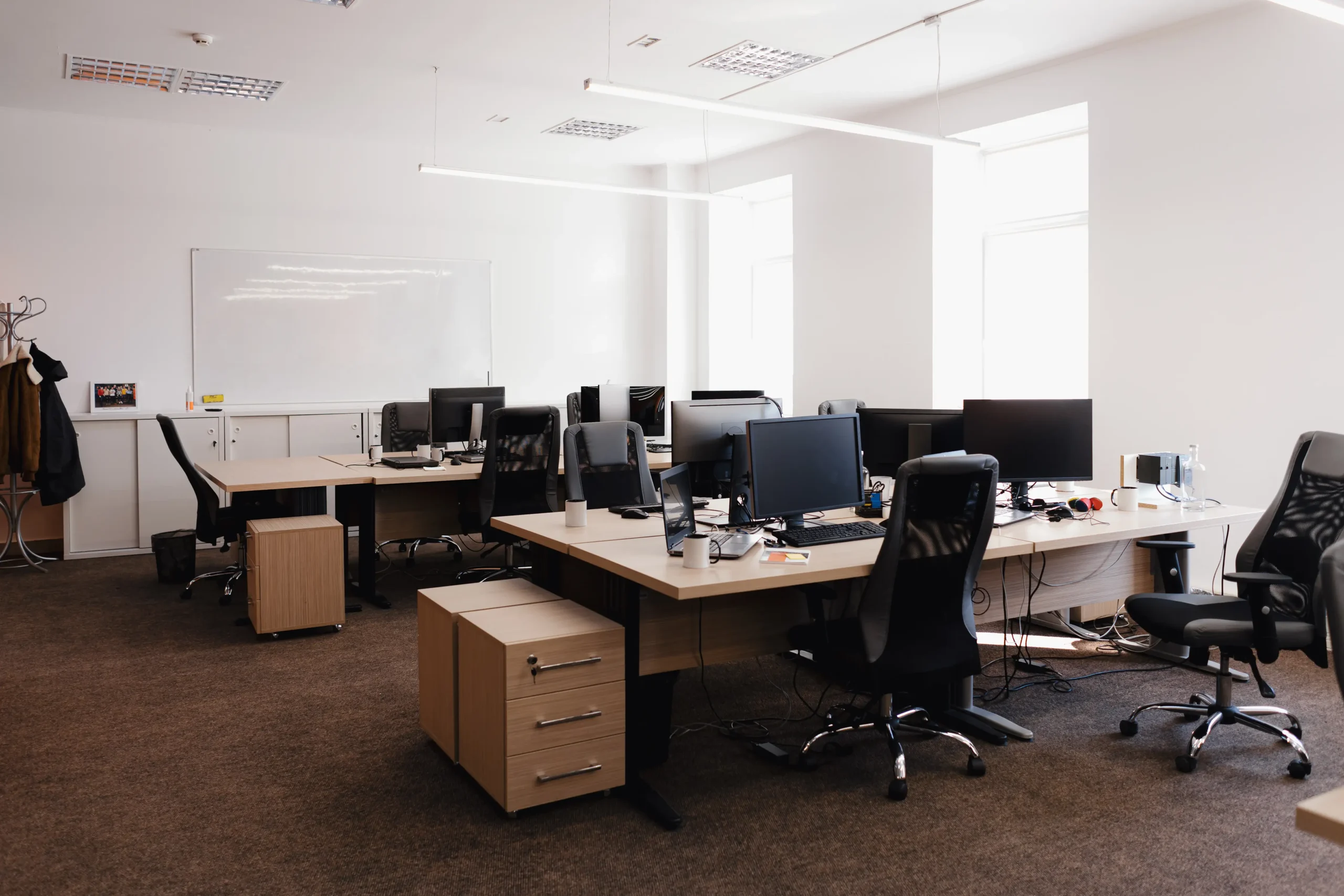 Commercial painters London working on modern office painting and decorating with clean workspace setup