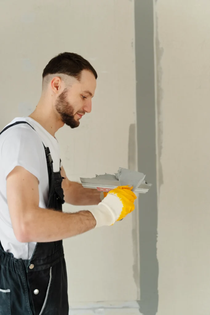 professional doing plastering work in london